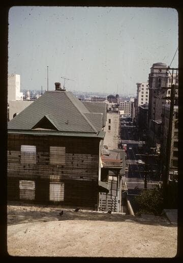 Corner building wrecked and cleared at 3rd Street
