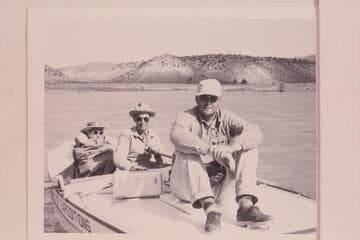 Wright party on the Green River: Kent Frost is at the oars, Fern Frost is bundled in the bow and Mel Hurley sits on the stern