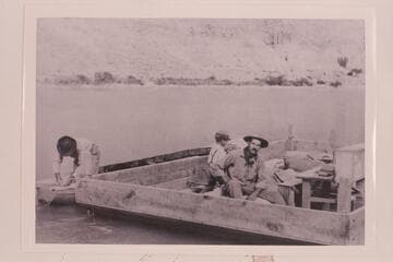 The "Canopy" without the canopy is moored at left of the scow. Tommy Richardson and Arthur C. Waller are in the scow after return of the "Canopy" from cruise to Mile 105 which would be following Aug. 31