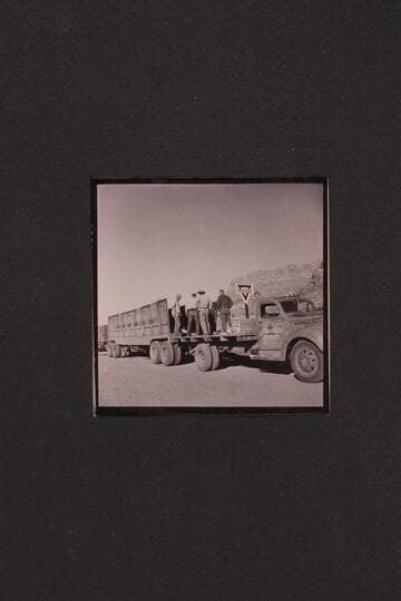 Unloading boats at Cliff Dweller's Lodge. Boat in truck trailer with Art Greene's truck ready to take it