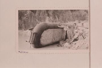 Patching one of the Bus Hatch boloney boats at Phantom Ranch. Bob Bader standing at right