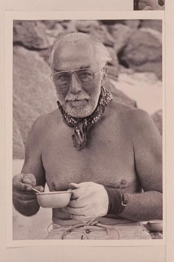 Frank E. Masland, "Fisheyes," takes care of a hot cup of coffee. Grand Canyon traverse of 1954, June. Diamond Creek