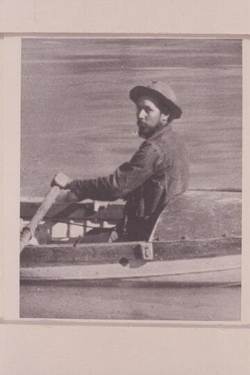 Charles Silver Russell at the oars of the "Utah." Pipe Creek. Grand Canyon