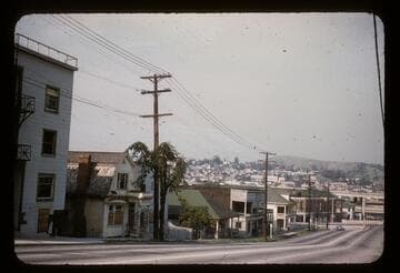 Bunker Hill being demolished. Flower Street at Court Street, looking toward the freeway