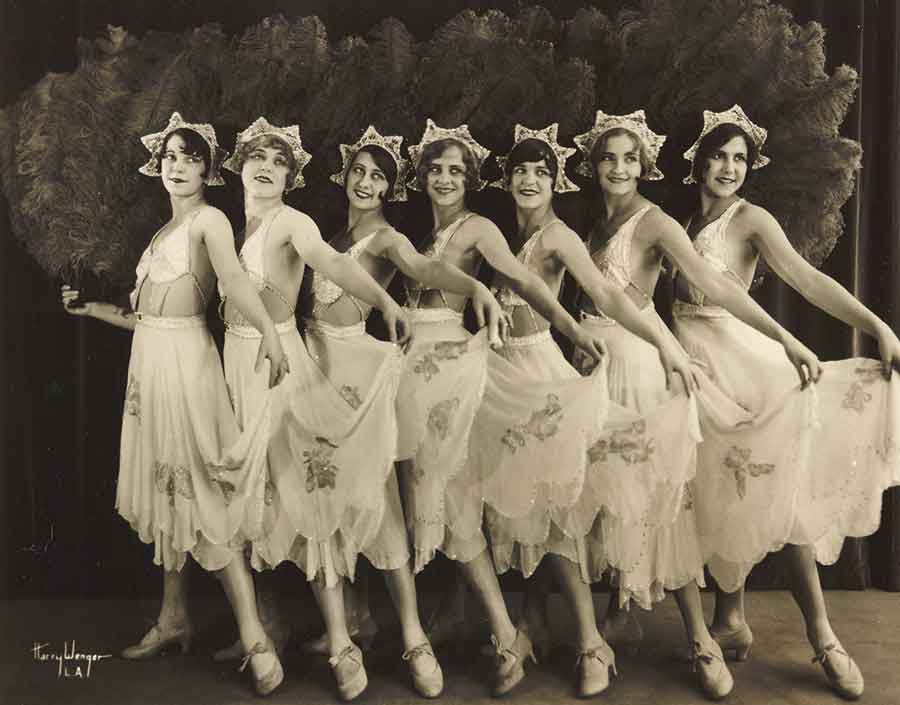 “The San Francisco Beauties,” the first female tap dance lineup on the West Coast, 1927. The dancers are (left to right): Alice Sullivan, Zeta Harrison, Reva Howitt (stage name “Lollipop”), Marge Hacker, Alice Haas, Idis Hacker. In her book, Lollipop: Vaudeville Turns with a Fanchon and Marco Dancer, Howitt wrote that, at the end of 1925, she was selected to be “one of the San Francisco Beauties, Fanchon and Marco’s premiere showgirls.” Photograph by Harry Wenger. “The San Francisco Beauties,” the first female tap dance lineup on the West Coast, 1927. The dancers are (left to right): Alice Sullivan, Zeta Harrison, Reva Howitt (stage name “Lollipop”), Marge Hacker, Alice Haas, Idis Hacker. In her book, Lollipop: Vaudeville Turns with a Fanchon and Marco Dancer, Howitt wrote that, at the end of 1925, she was selected to be “one of the San Francisco Beauties, Fanchon and Marco’s premiere showgirls.” Photograph by Harry Wenger.