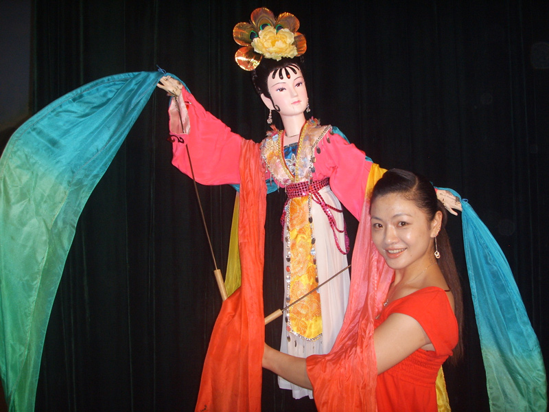 Woman with Chinese puppet Woman with Chinese puppet